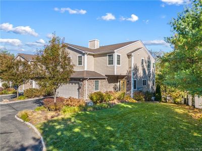 View of front of home with a front yard and a garage | Image 2