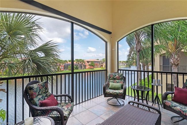 Sunroom featuring a water view | Image 20
