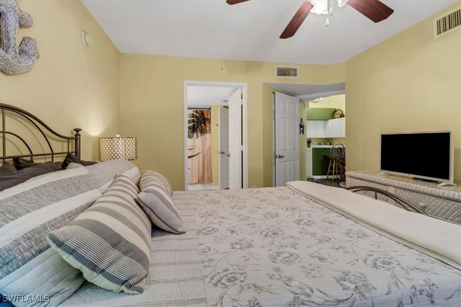 Bedroom with a ceiling fan | Image 19