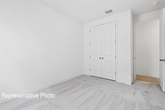 Unfurnished bedroom with carpet, a closet, baseboards, and visible vents | Image 18