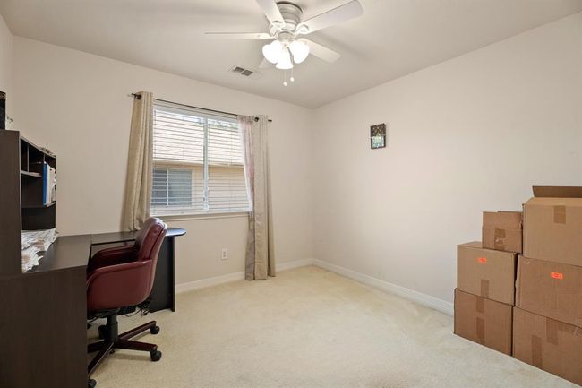 Secondary bedroom 3 is currently being used as an office. | Image 20