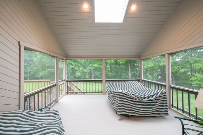 Fabulous Screened-In Porch with skylight for enjoyable bug-free gatherings | Image 22