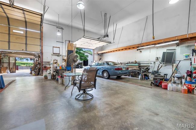 Garage featuring a garage door opener | Image 39