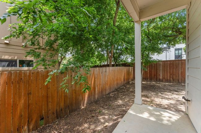 View of fenced backyard | Image 20