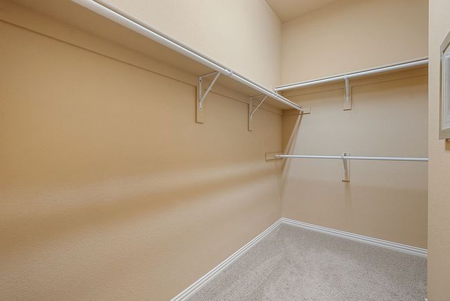 Spacious closet with carpet | Image 18
