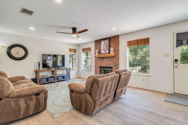 2nd Living room (Den) is located adjacent to the kitchen & breakfast area, and features newly installed can lighting! | Image 12