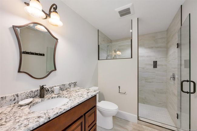 Full bathroom with vanity, a stall shower, and marble finish floors | Image 65