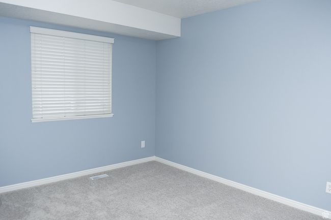 Unfurnished room with baseboards, visible vents, and carpet floors | Image 7