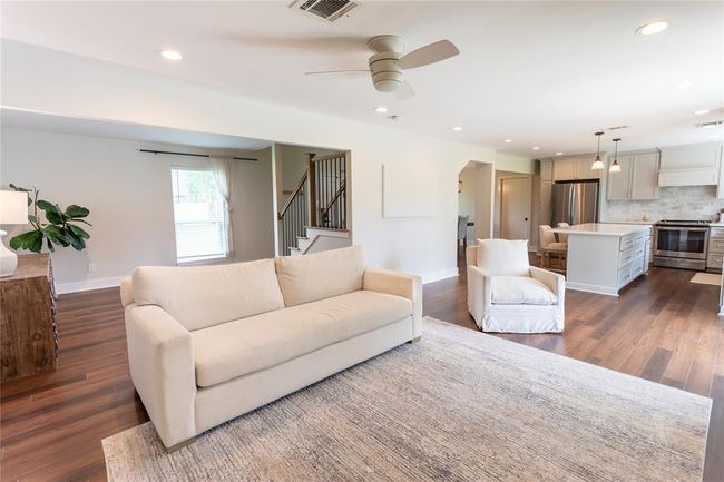 Spacious living room that opens up to the kitchen | Image 8