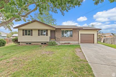 View of front of property with a front lawn and a garage | Image 2