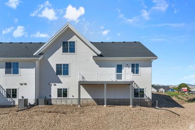 Rear view of house with central AC unit | Image 3