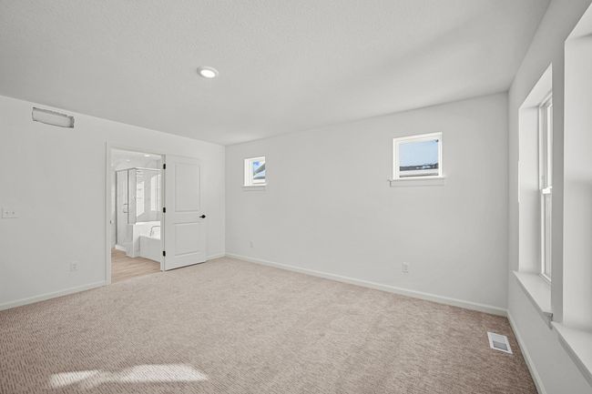 Owner's Suite with en suite bath featuring a separate tub / shower. | Image 11