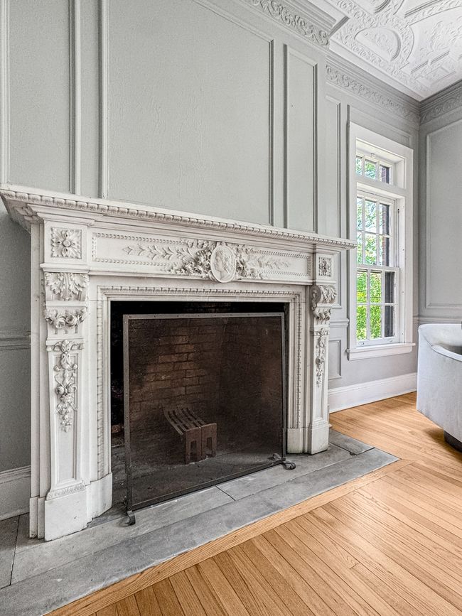 This ornate fireplace in the dining room features | Image 13