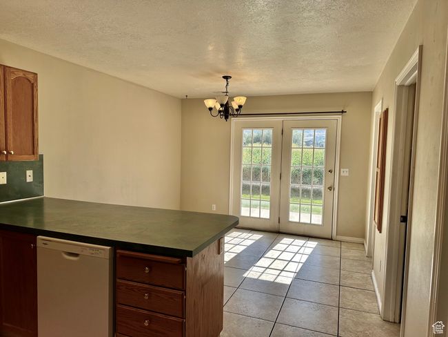 Kitchen and dining area with both space and function in mind with ample space for a table | Image 7