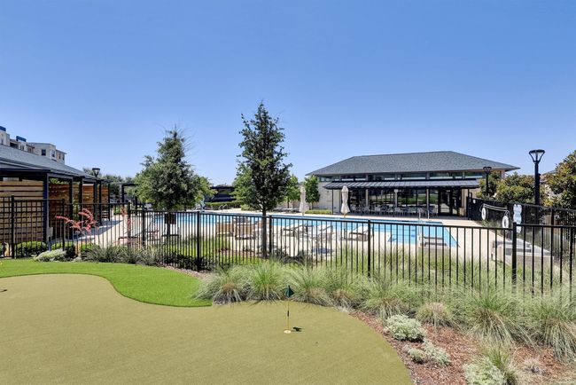 Community pool with a putting area and a gazebo | Image 29