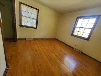 Unfurnished room with light hardwood / wood-style floors | Image 3