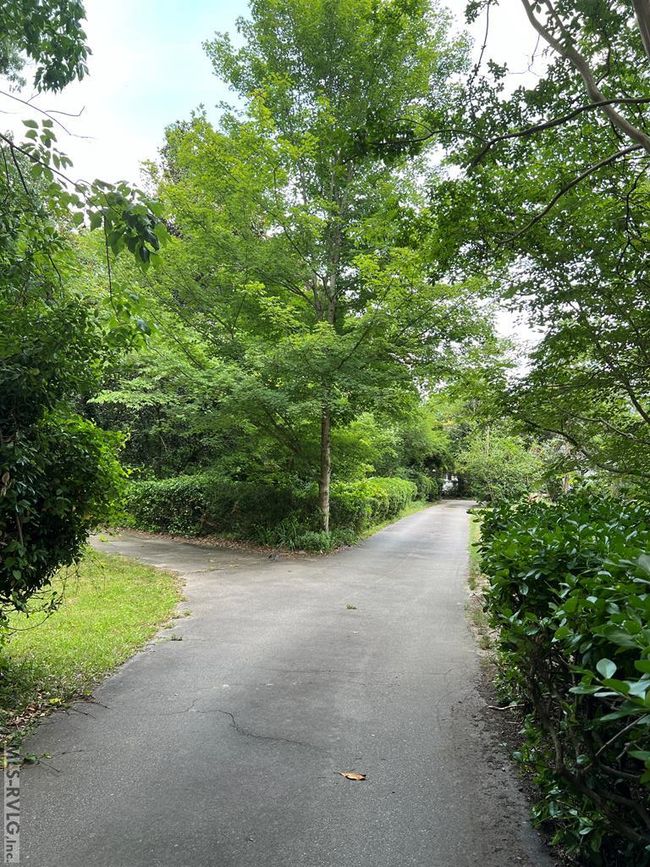 Driveway Splits to the Left to Double Garage | Image 50
