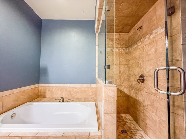 Bathroom with a stall shower and a garden tub | Image 15
