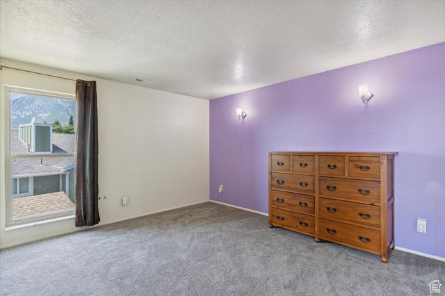 Carpeted empty room with a textured ceiling | Image 21