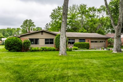 Lots of large mature trees in the front yard. | Image 3