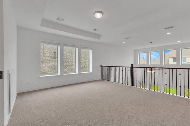 Spare room featuring carpet and a chandelier | Image 22