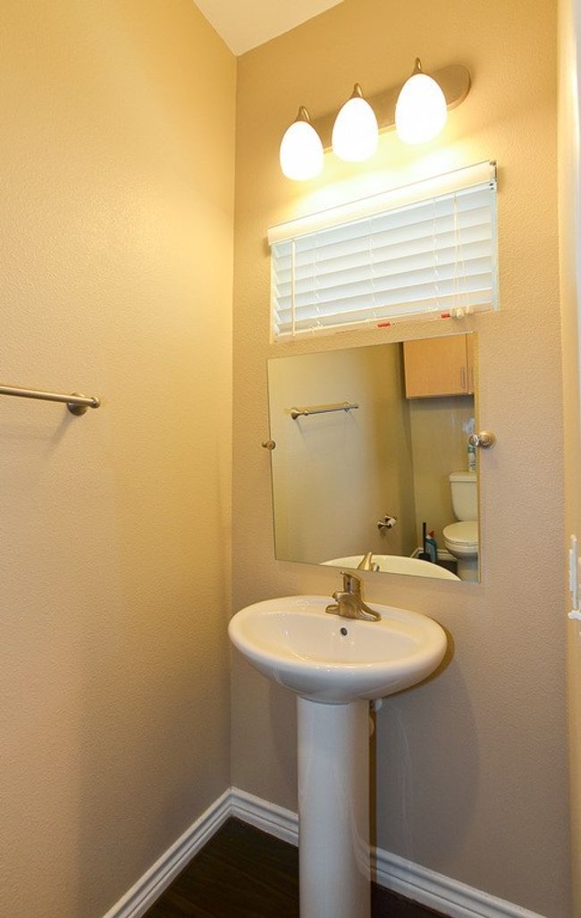 Half bath located on the second levelwith the kitchen and main living space | Image 8