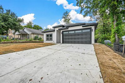 View of front facade with a garage | Image 3