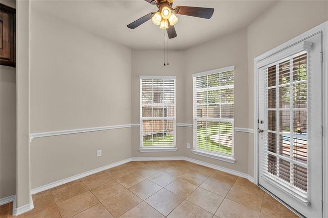 Enjoy tranquil backyard views from the bright breakfast room. | Image 14