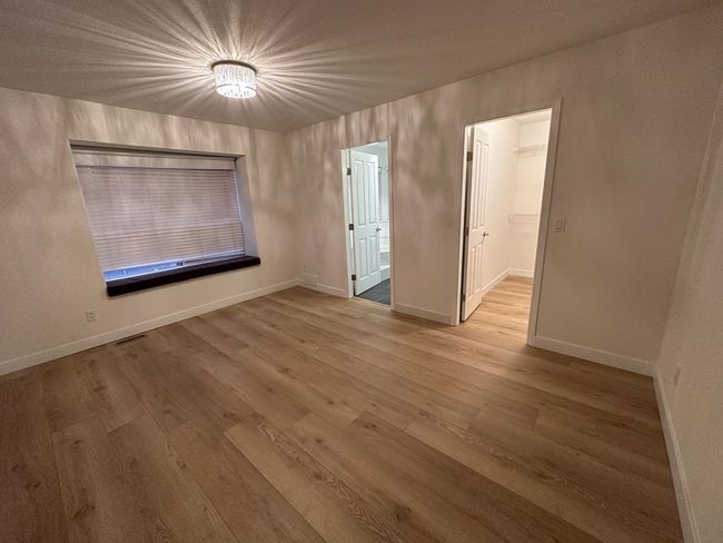 Empty room featuring visible vents, baseboards, and light wood-style floors | Image 8
