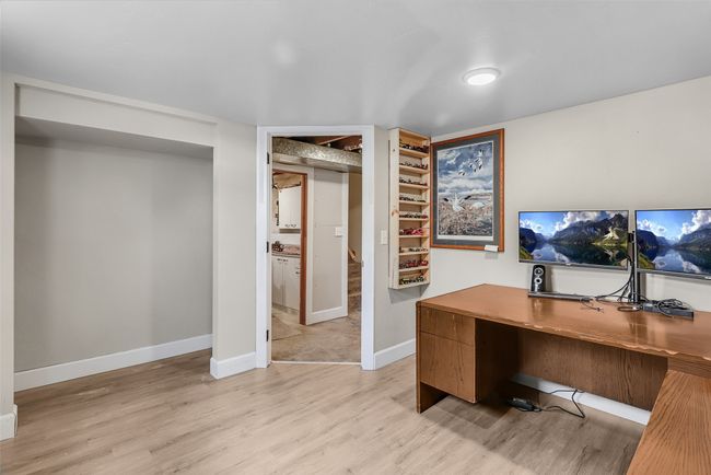 Home office with light wood finished floors and baseboards | Image 27
