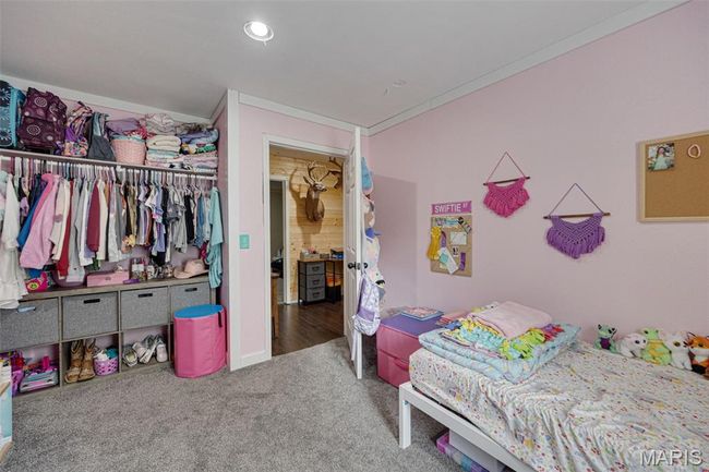 Bedroom featuring carpet flooring and a closet | Image 19
