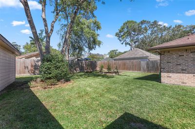 Spacious backyard is large enough for a luxury pool and could be extended to build in an outdoor summer kitchen for alfresco dining and great entertaining | Image 2