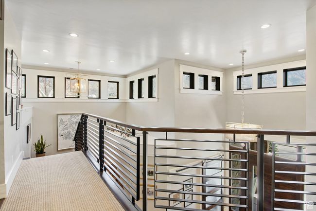 Hall featuring a chandelier, an upstairs landing, and recessed lighting | Image 53