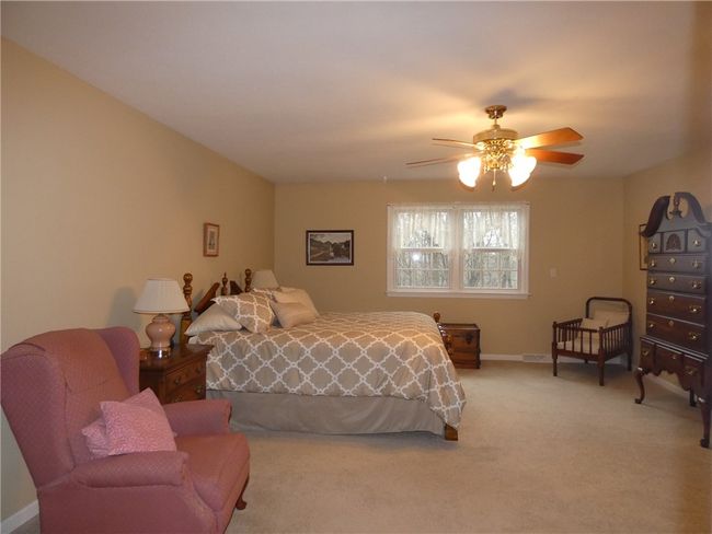 The large master bedroom is ample and offers quiet respite for those good night's sleep | Image 28