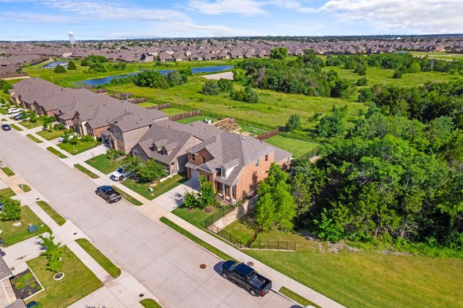 Aerial perspective of suburban area with a nearby body of water | Image 34
