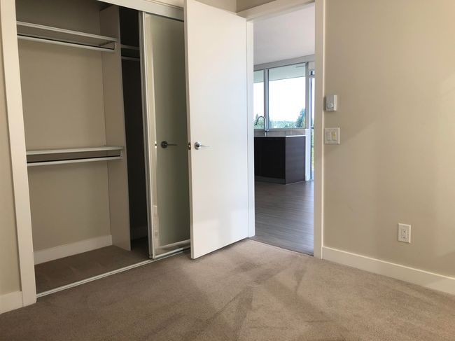 Unfurnished bedroom with baseboards, a closet, and carpet | Image 7