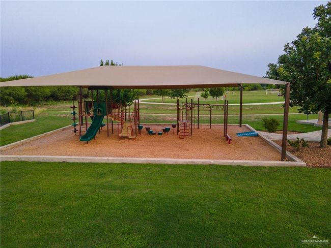 Communal playground with a lawn | Image 44