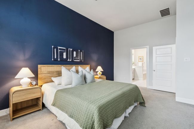 Carpeted bedroom with baseboards and ensuite bathroom | Image 12