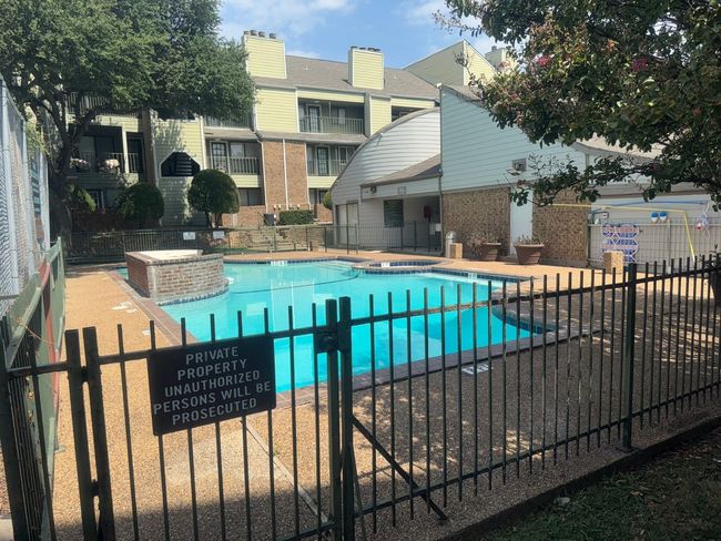 Community pool with a patio | Image 18