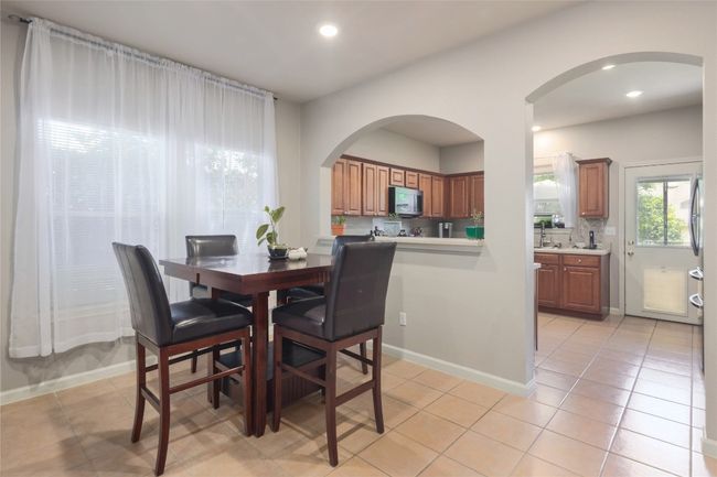 Spacious separate dining room situated between the kitchen and living room | Image 7
