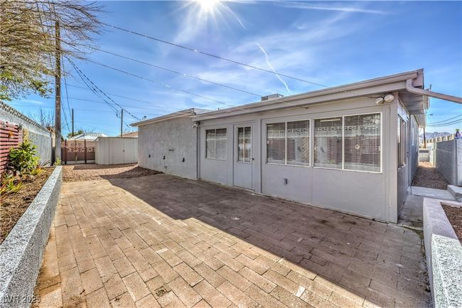 Back of house featuring a fenced backyard, a patio, and stucco siding | Image 38