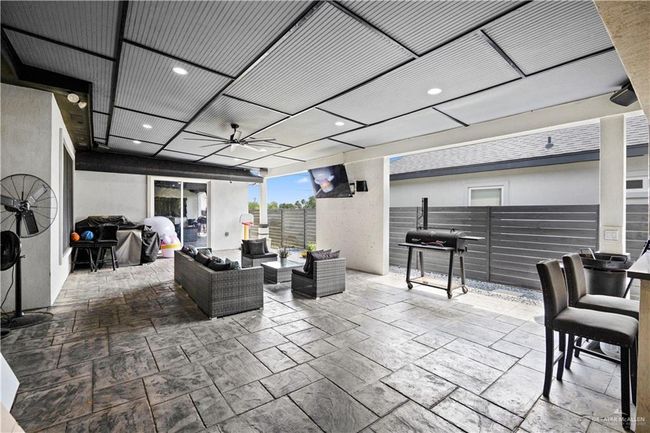 View of patio / terrace featuring a ceiling fan, an outdoor living space, and grilling area | Image 5