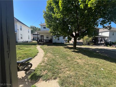 View of yard with a porch and a carport | Image 3