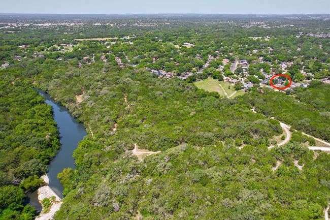 Aerial view of property's location featuring a forest and a large body of water | Image 34