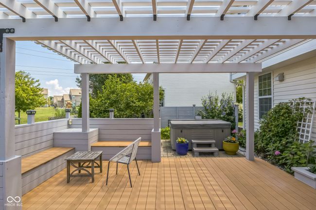 deck featuring a hot tub and a pergola | Image 35
