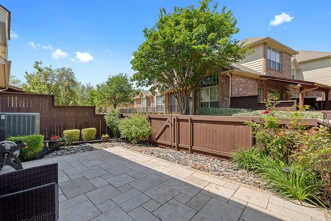 View of patio / terrace with a gate, a fenced backyard, and cooling unit | Image 34