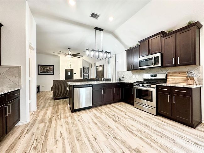 Thoughtfully designed and meticulously maintained like-new open concept home with upgrades galore! Better than new! | Image 9