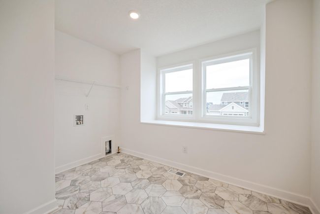 Photo is of the actual home. Upper level laundry. | Image 15
