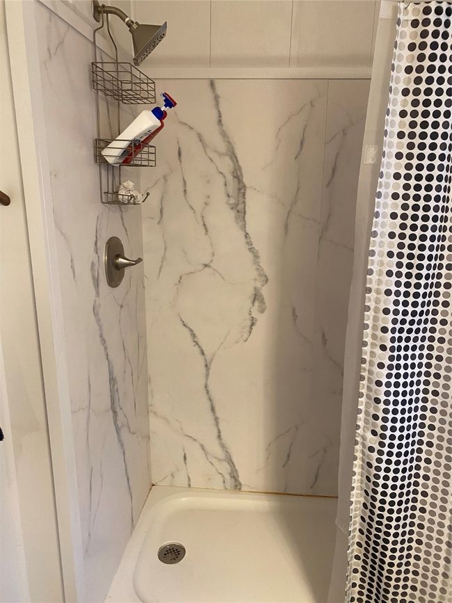 Bathroom with a marble finish shower | Image 10