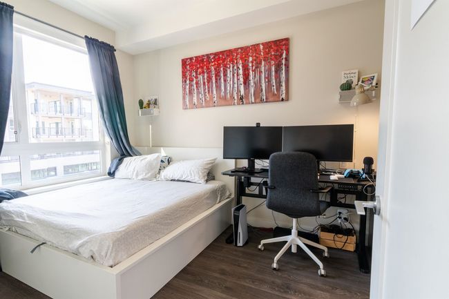 Bedroom with dark wood-style flooring | Image 9